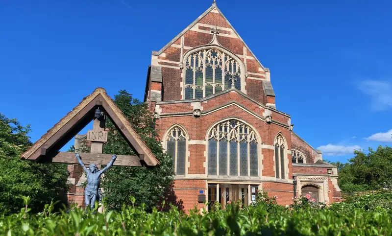 All Saints Church, East Finchley, under a blue sky