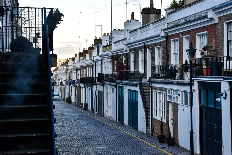 Row of white stucco townhouses in Holland Park, London