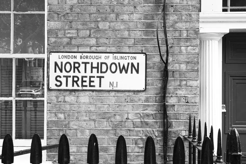 Northdown Street sign on a brick wall in Islington, in black and white